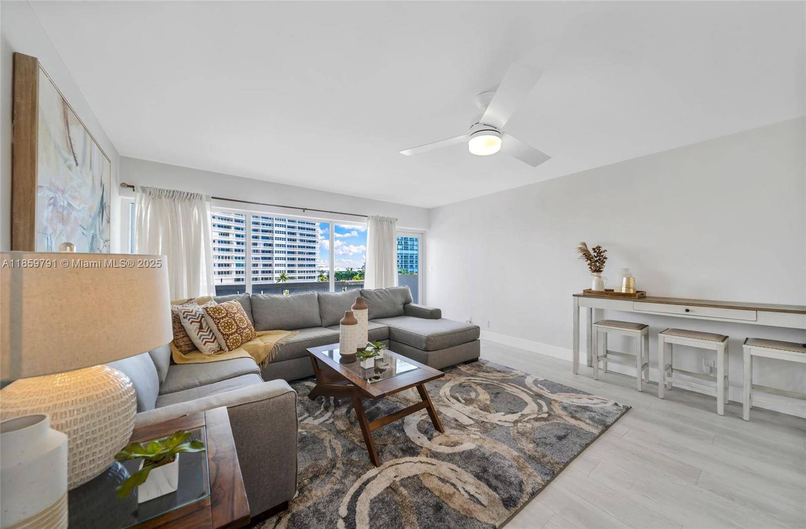 Tucked in the exclusive Harbor Beach community, this updated Sky Harbour East residence offers an open kitchen, spacious interiors, walk in closet, impact windows, and in unit laundry.