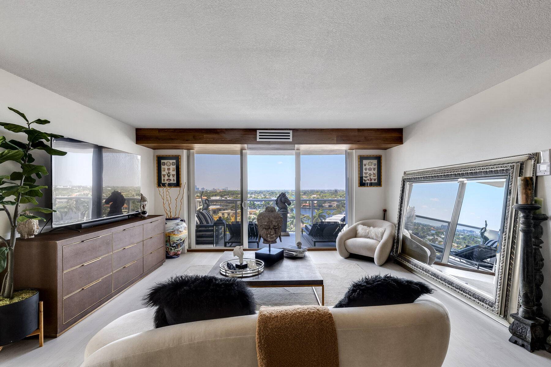 Welcome to refined living, recently renovated unit with impact floor to ceiling windows, picturesque views of both Intracoastal and ocean.