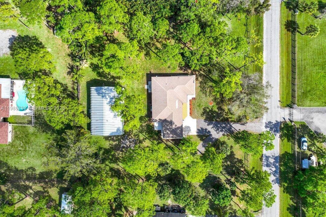 Unlock the quintessential Loxahatchee lifestyle with this unique, opportunity rich property set on expansive land with endless potential.