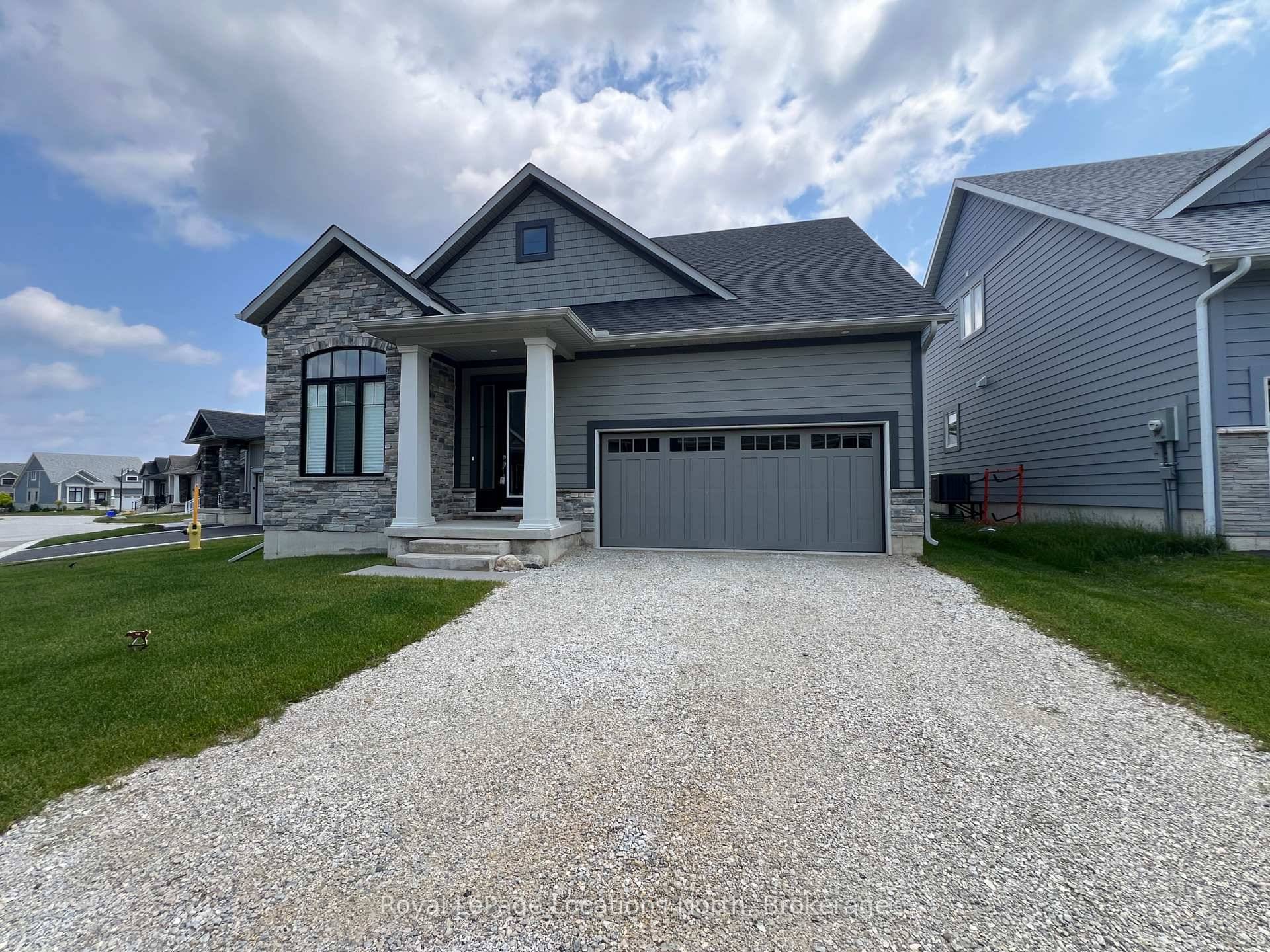 Welcome to 123 Beacon Drive in The Cottages at Lora Bay where timeless design meets modern luxury.