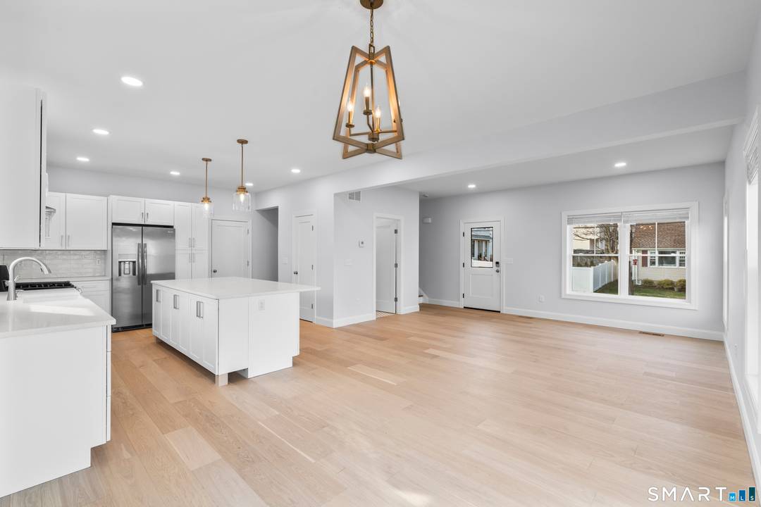 Beautiful newly constructed half duplex offering modern design, quality craftsmanship, and flexible living space.