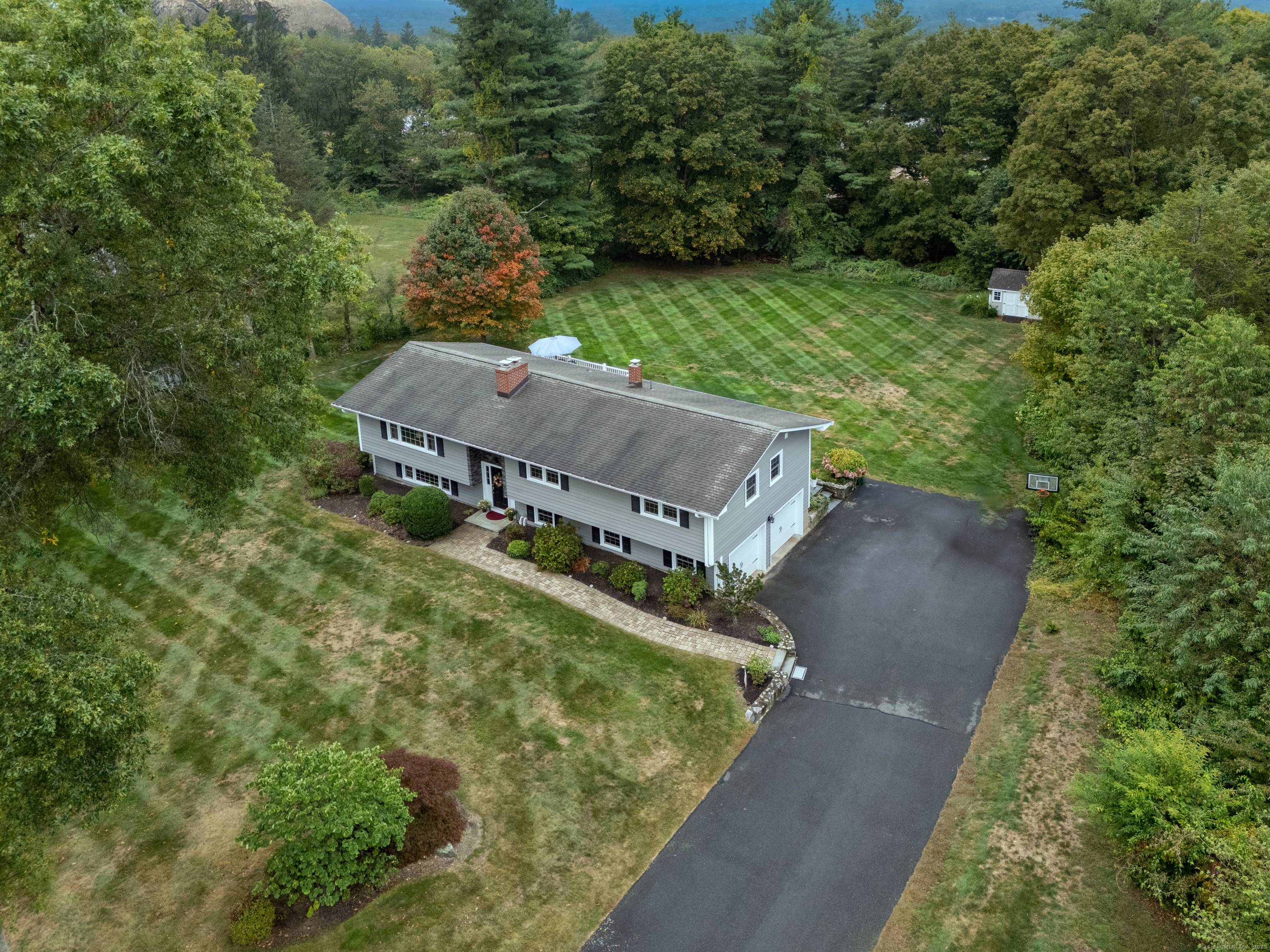 Welcome to this beautifully updated and expansive 5 bedroom, 3 bathroom Raised Ranch, perfectly situated on a flat, professionally landscaped 1 acre lot.
