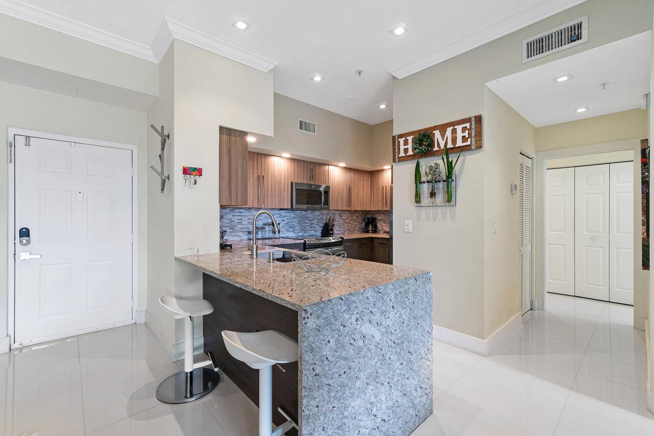 This exquisite, newly renovated condo is situated in the gated community of Saint Andrews at the Polo Club, right in the heart of Wellington.