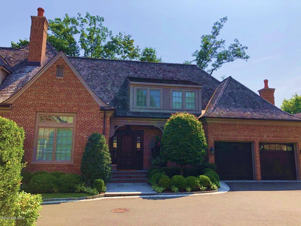YOUR SEARCH IS OVER ! Beautiful Townhome End unit nestles in a private setting offering 4, 000 sq.