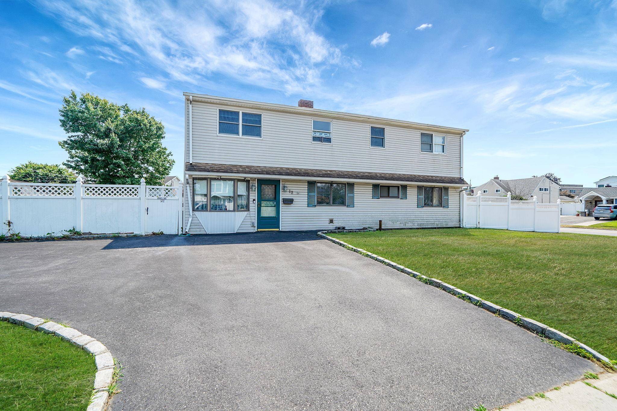 Welcome to 16 Winter Lane, a one of a kind Colonial home on a spacious corner lot in the heart of Hicksville !