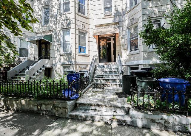 Welcome to this charming legal three family residence.