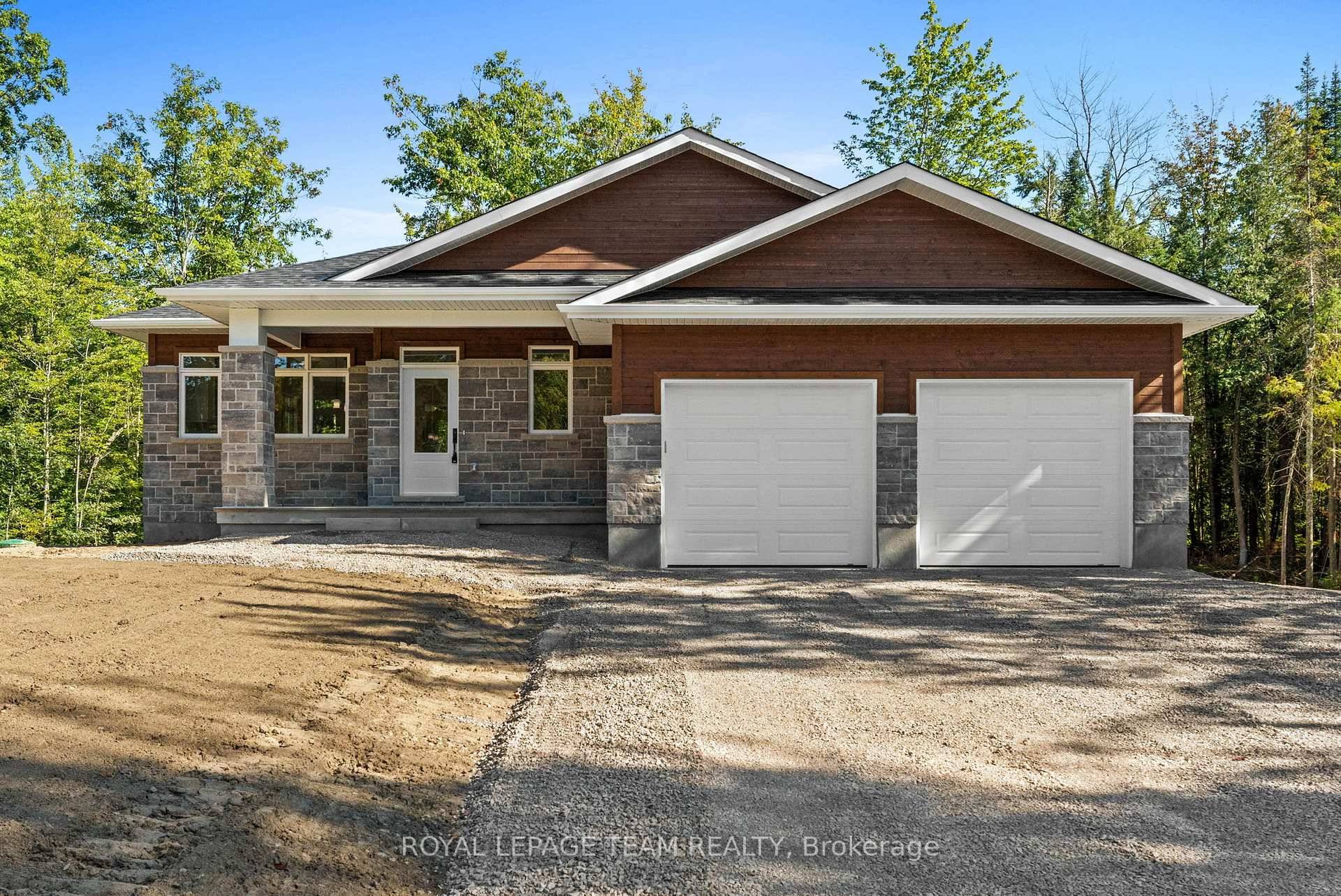 Located in the second phase of Hogan Heights, this beautifully designed bungalow combines country charm with modern convenience.