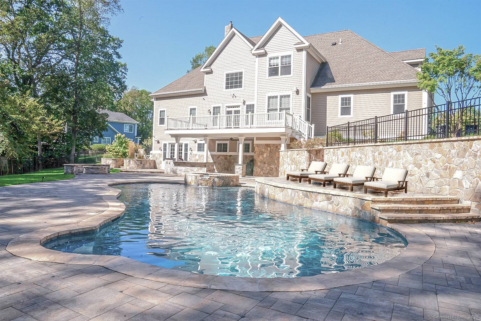 Nestled in the premier Farm River Estates, this stunning residence offers a peaceful cul de sac setting surrounded by woodlands.