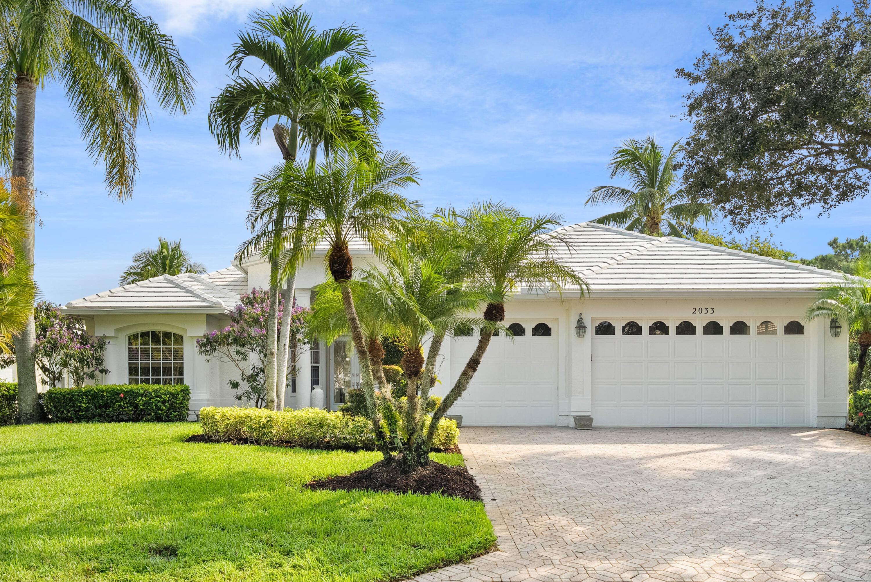 ''Timeless neoclassical home with modern renovations in the man gated Monarch community of Palm City.