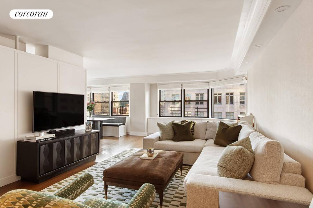 6 rooms 3 beds 3 baths Residence 16ABG, a high floor corner three bedroom in Saxon Towers, offers open east and south exposures, oversized windows, and generous proportions throughout.