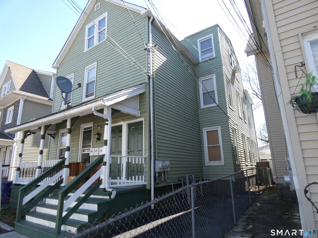 Solid three family home featuring three bedrooms in each unit.