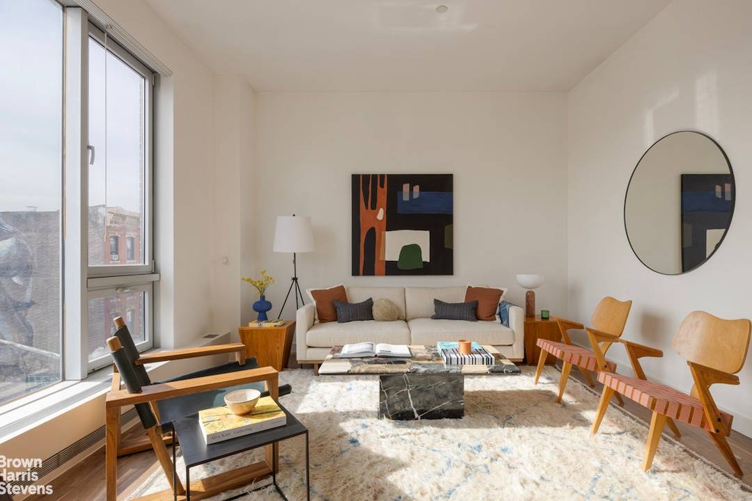 SPACIOUS, SUN SOAKED 2 BEDROOM CONDO IN THE HEART OF WILLIAMSBURG WITH PRIVATE BALCONY.