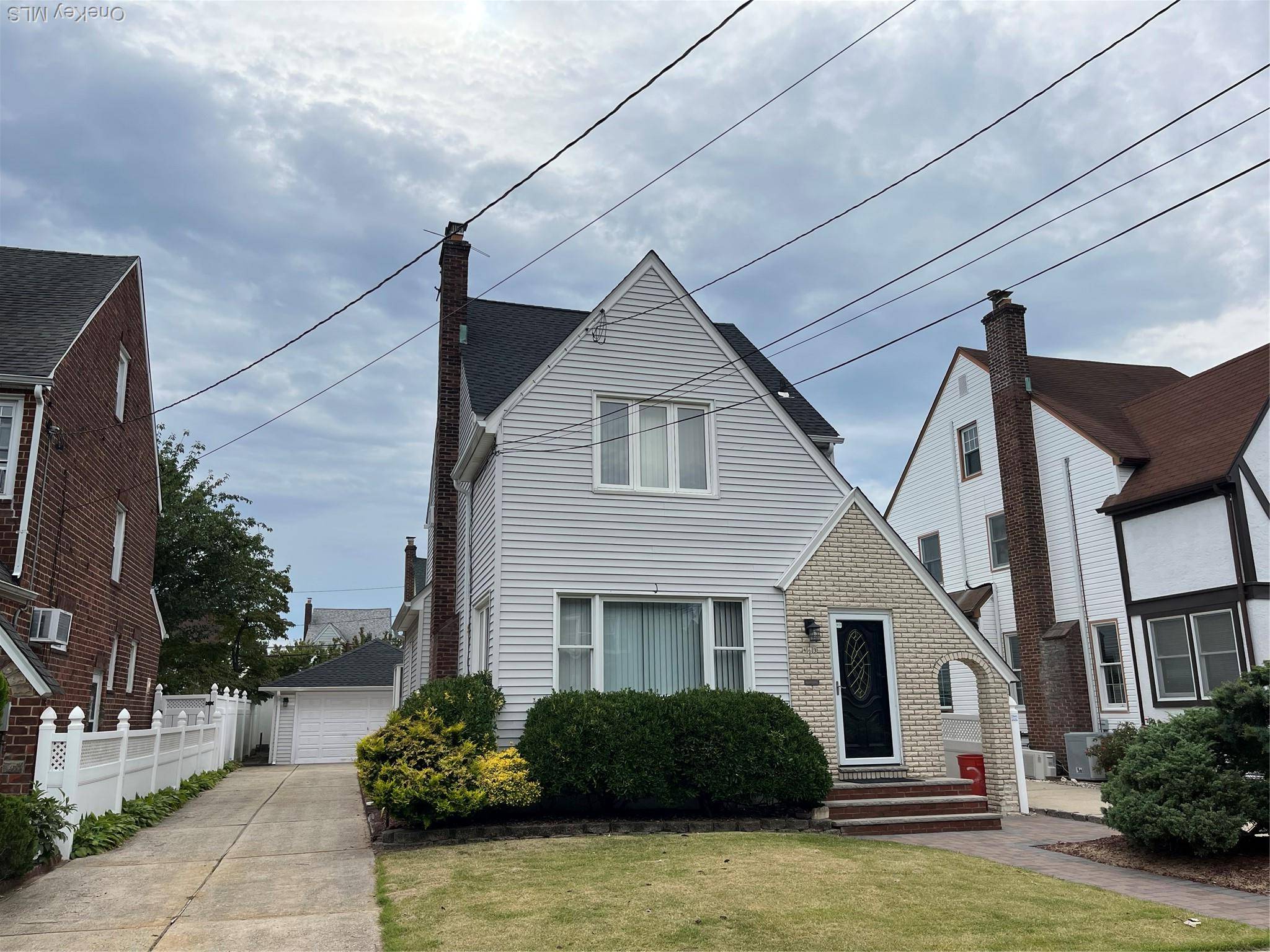 Welcome to Saville Estates and this Beautiful Tudor Colonial In the Heart Of Mineola on a Quiet Tree Lined Street.