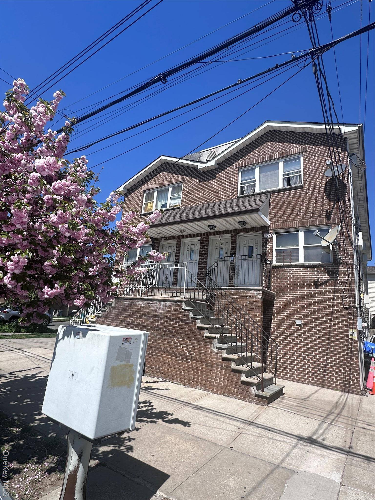 Unlock the potential of this outstanding 2 family residence with a finished basement !