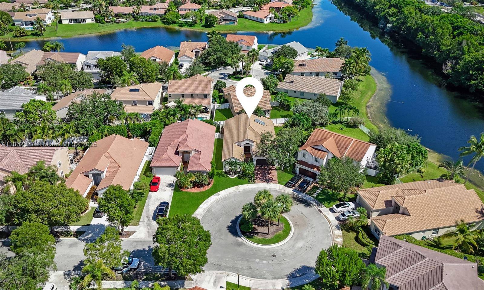 PRICED TO SELL ! Beautifully updated one story home, ideally located on a quiet cul de sac in the gated community of The Lakes in Weston.