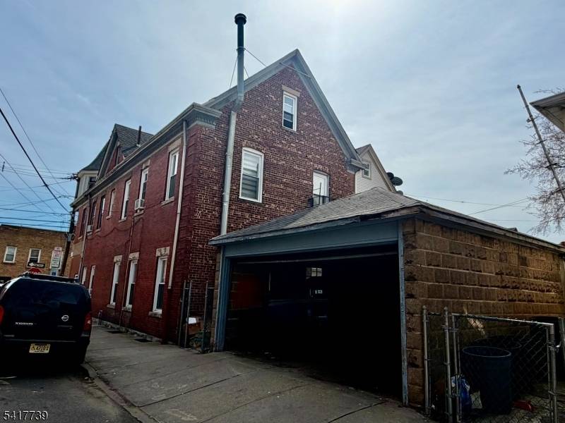 Legal four family brick building located on a corner property in Clifton offering a strong investment opportunity with additional upside potential.