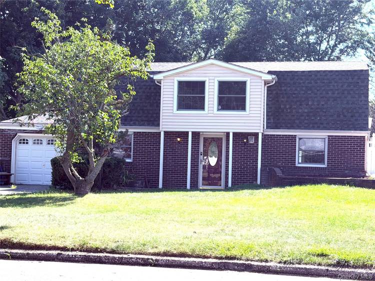 Spacious single family 4 bedroom, 2 bath Dutch Colonial nestled on a quiet street in the highly sought after Three Village School District.