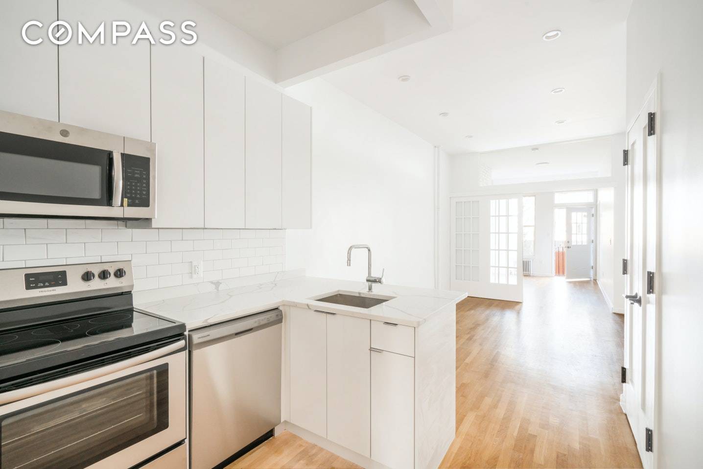 Enjoy the best of Williamsburg life in this recently renovated 2 bedroom 2 bath apartment with your OWN SPACIOUS BACKYARD !