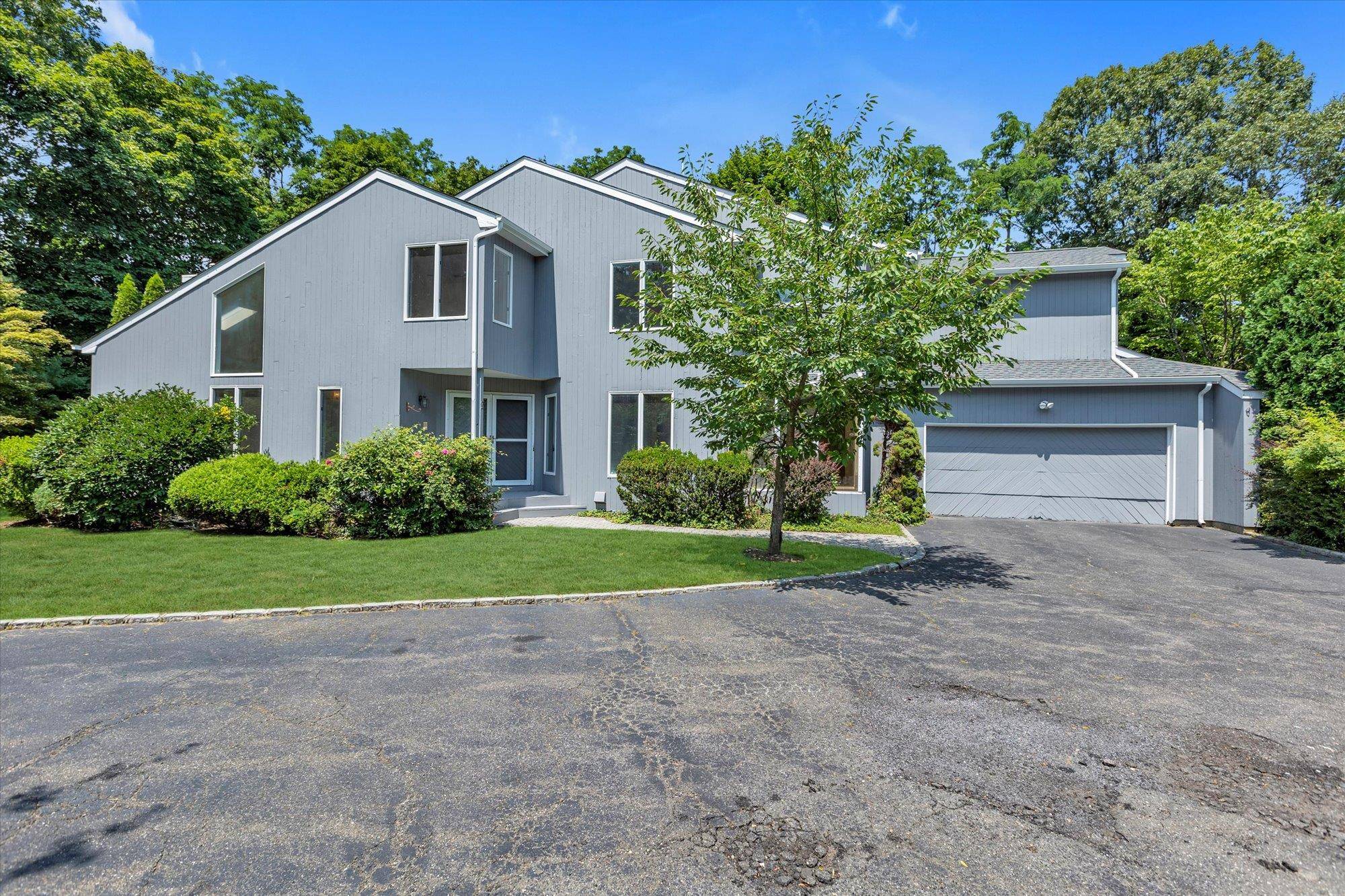 Welcome to 2 Heiko Court, a beautifully maintained townhome tucked within the Colony Club a private, gated, community in the heart of Fort Salonga.