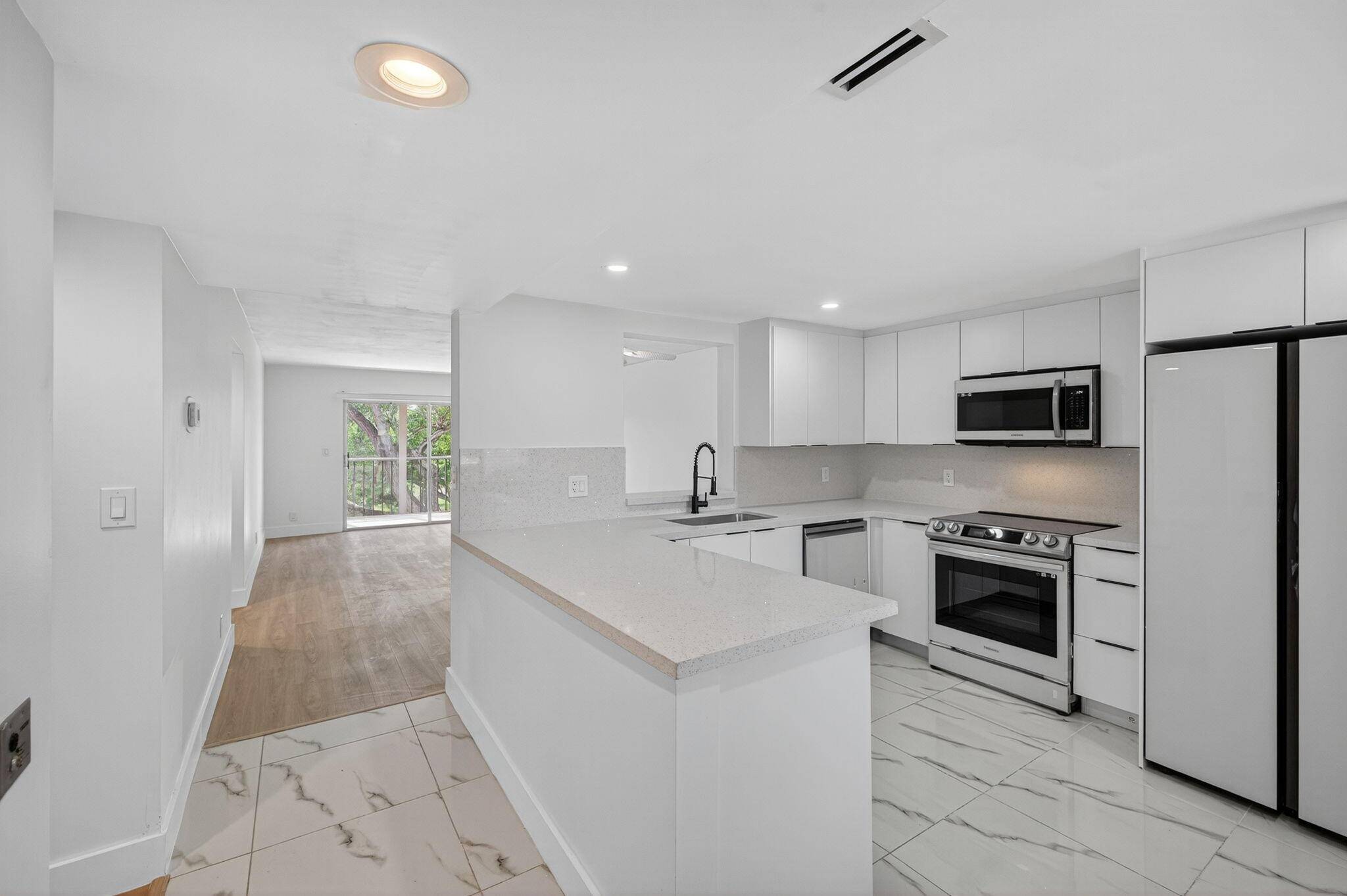 Welcome to this fully remodeled condo w stunning lake views in the vibrant 55 community of Huntington Lakes !