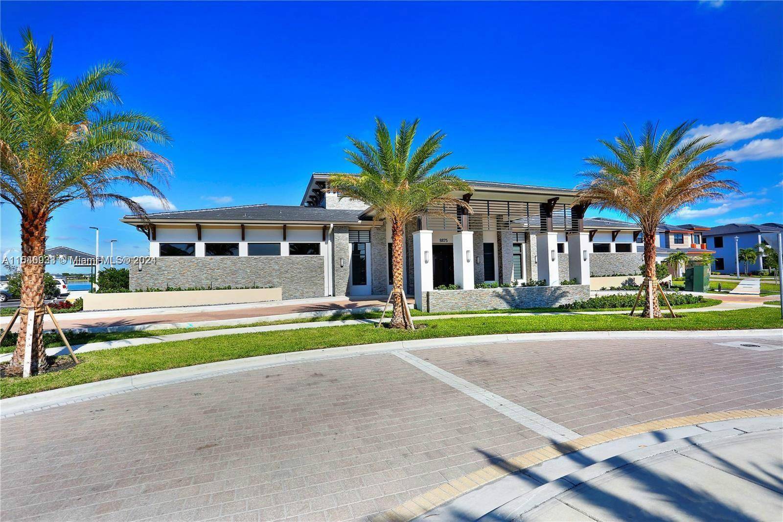 The breathtaking lakefront resort style two story brand new home is located in Miami Lakes exclusive SATORI community !