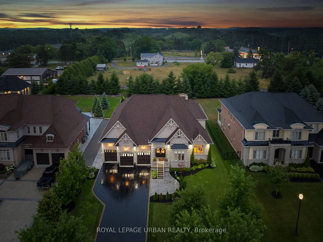 Welcome to this luxurious 6 bedroom, 5 bath bungaloft, perfectly positioned on an impressive 85 x 205 ft lot within one of Uxbridge's most exclusive gated golf course communities.