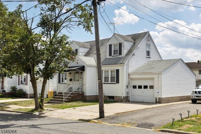 Move in ready Cape Cod on a quiet tree lined street.