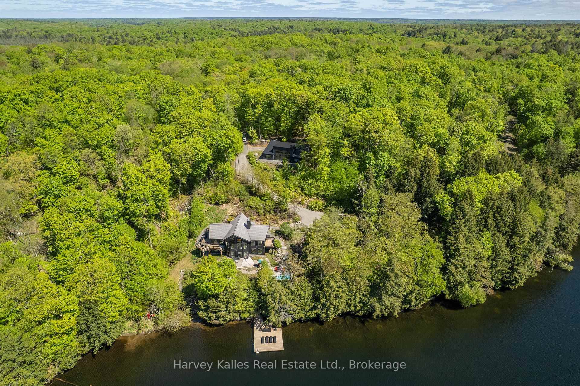 Exceptional year round lakeside retreat offering 468 feet of frontage on beautiful Bruce Lake with southern exposure for all day sunlight.