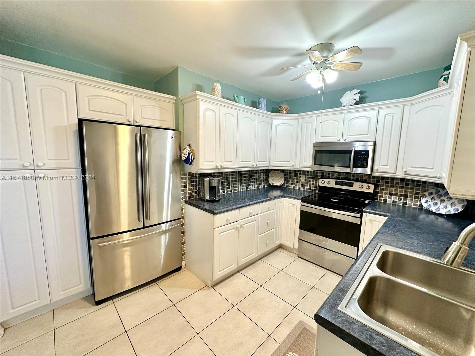 Beautiful water views of Golden Isles Lake from this 2 bedroom 2 bathroom waterfront condo in Hallandale Beach.