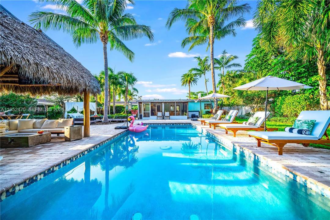 4BR 3BA on a rare 1 4 acre lot with a fully fenced, resort style backyard featuring a heated pool, jacuzzi, sunroom, and tiki hut with bar, just 5 minutes ...