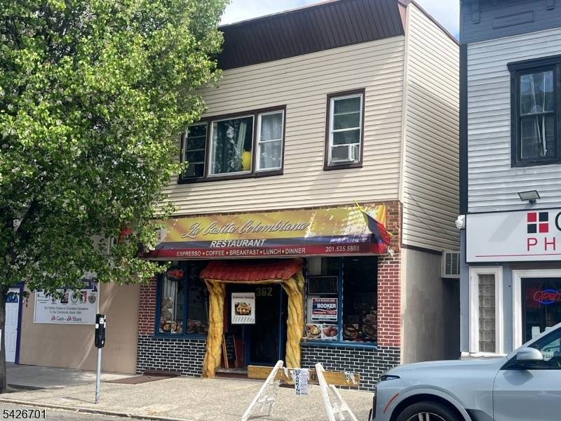 Prime Broadway Location. Income producing Fully Rented Mixed use property composed of a Restaurant with full basement and an A2 Bedroom Apartment.