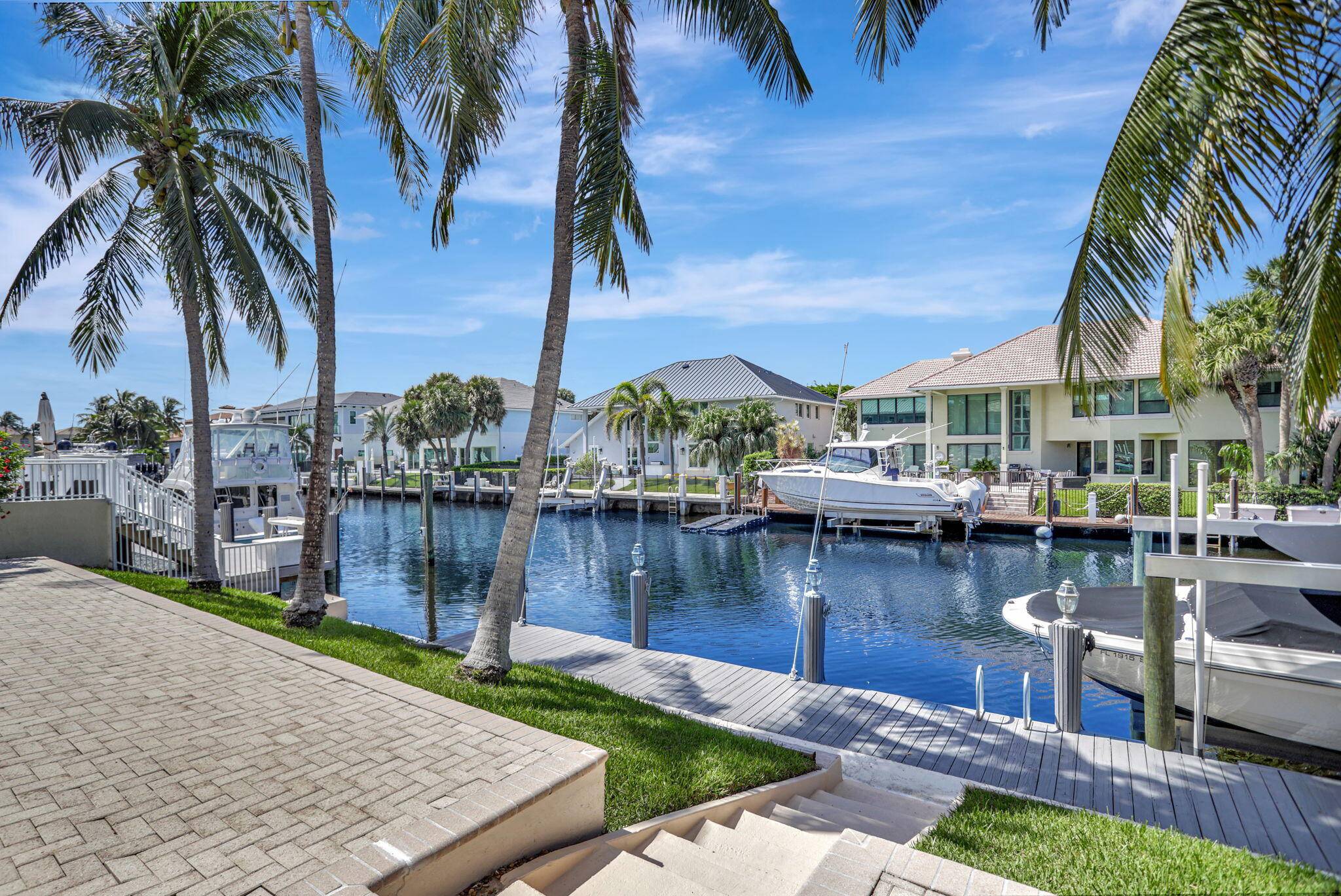 This expansive 2 story waterfront home is situated on one of the most sought after streets in Lighthouse Point.