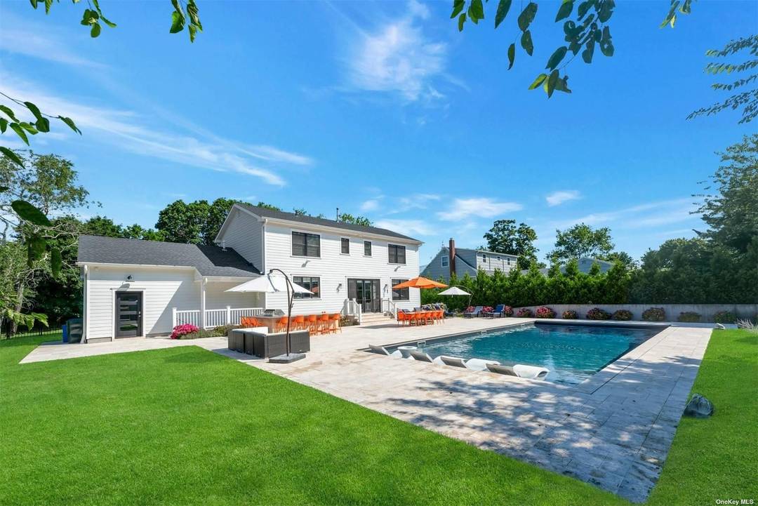 Luxurious Modern Home with Heated Inground Pool in Private Community with Memorable Bay Beach 3 Blocks Away.