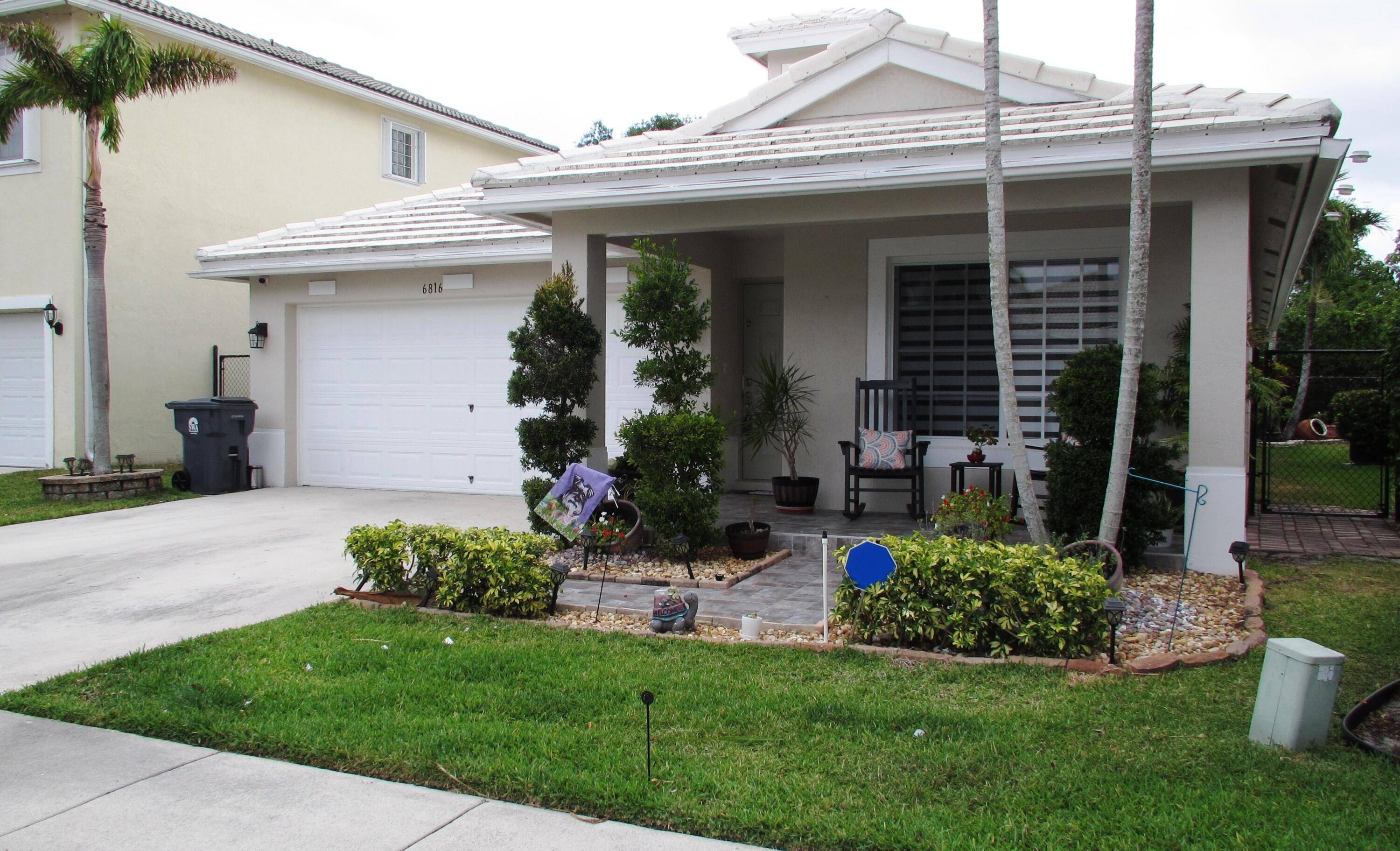 This immaculate single family home is nestled within the prestigious Lantern Key gated community.