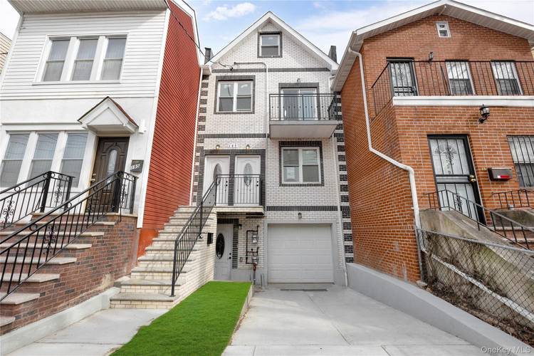 Newly constructed three bedroom, one bath home showcasing refined hardwood flooring, high ceilings, and modern stainless steel appliances.