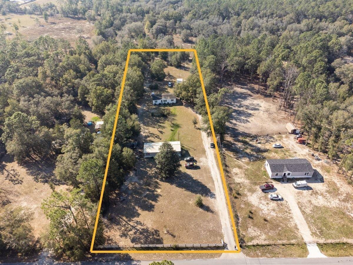 Rarely available 2. 24 acres with two income producing homes !