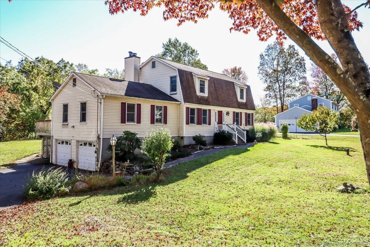 Home Sweet Home ! This eye catching Gambrel Colonial sits attractively on a lush, green acre in Sandy Hook, CT just 90 minutes from NYC !