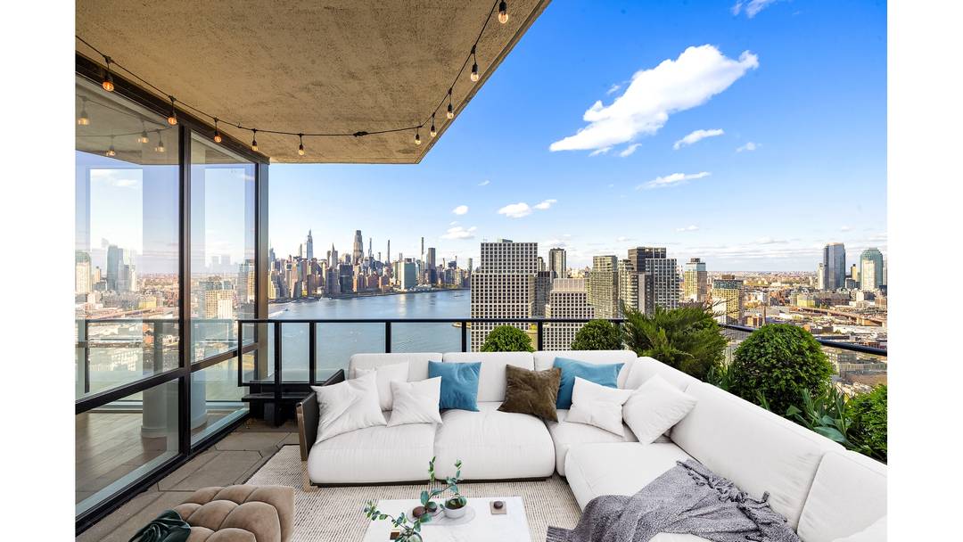 Residence 38C at The Greenpoint is a striking corner home that redefines elevated waterfront living.