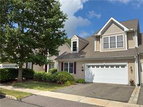 This meticulously maintained, Toll Brothers built, luxury condominium in Newington Ridge features a stunning first floor primary bedroom with gorgeous en suite bath and custom shelved walk in closet !