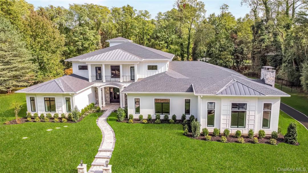 Discover this stunning newly built estate offering 8, 500 square feet of beautifully designed living space, set on two peaceful acres in the heart of Nissequogue.