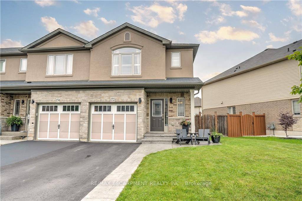 This beautiful freehold end unit townhouse is situated in one of Stoney Creek Mountain's coveted Heritage Green Neighbourhoods.