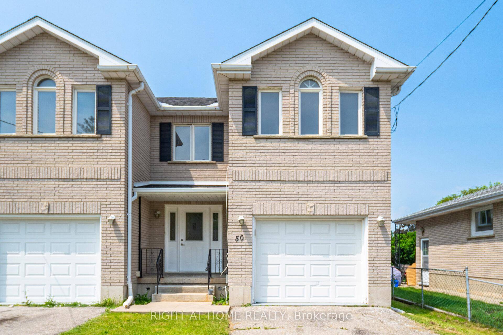 Fully Brick Beautiful 5 Level Backsplit Layout Completely Freehold End Unit Townhome with an Extra Long Driveway For Sale Where You Can Easily Park 3 Cars !