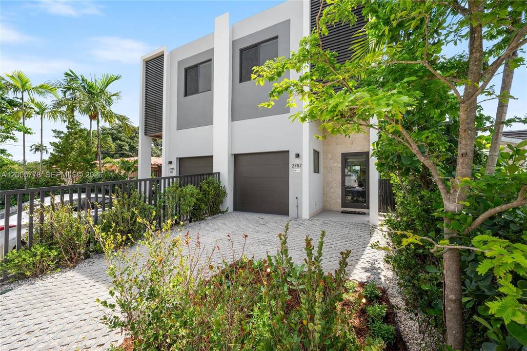 Modern new construction townhome offering luxury design.