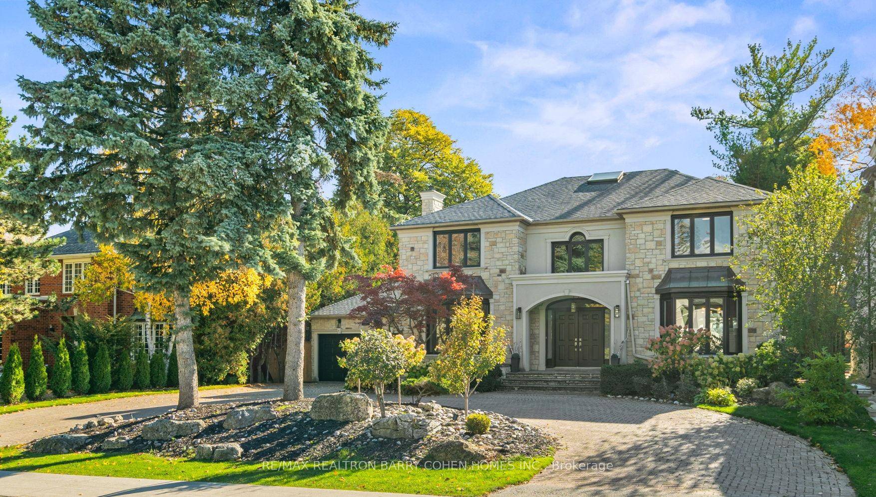 Stunning Newly Renovated in 2024 On Rare 80' Foot Wide South Lot With Circular Driveway.