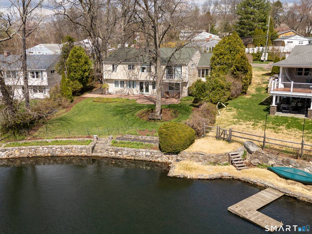 A very rare opportunity to join a delightful waterfront community on Coopers Pond in the Turn of River neighborhood in Stamford.
