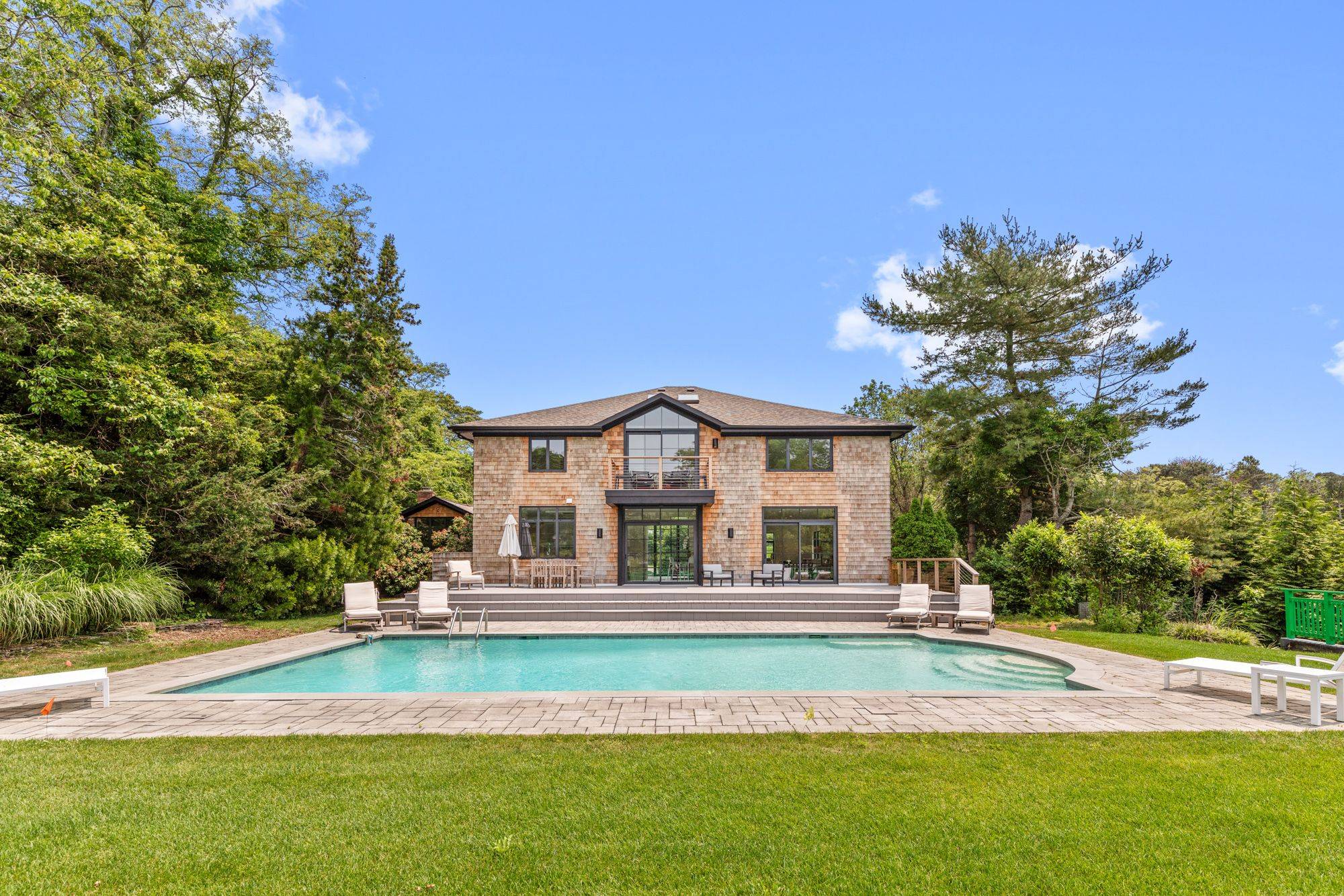 Experience refined European elegance in this beautifully reconstructed Southampton home, set on a full acre with curated design and high end finishes sourced from Italy.
