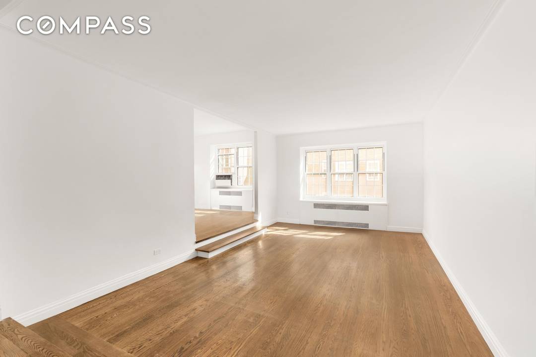 This move in ready two bedroom, two bathroom apartment seamlessly blends sleek, modern design with the unique charm of a pre war cooperative.