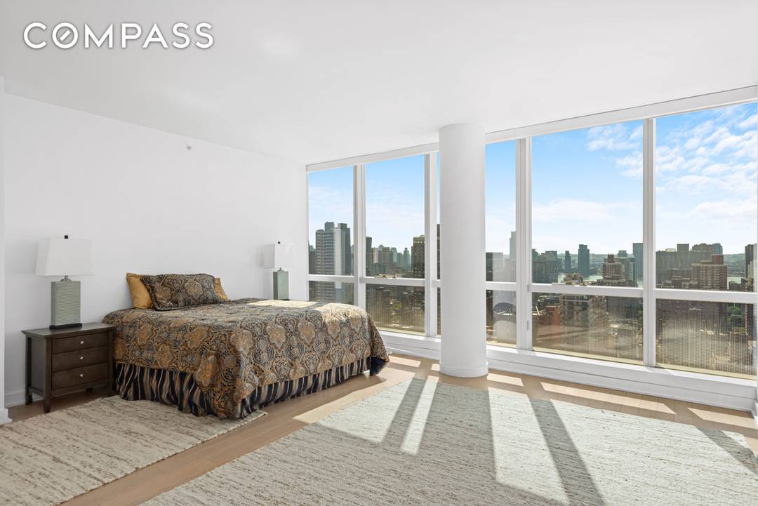 Floor to ceiling skyline city views from this huge newly constructed three bedroom plus study, three full baths.
