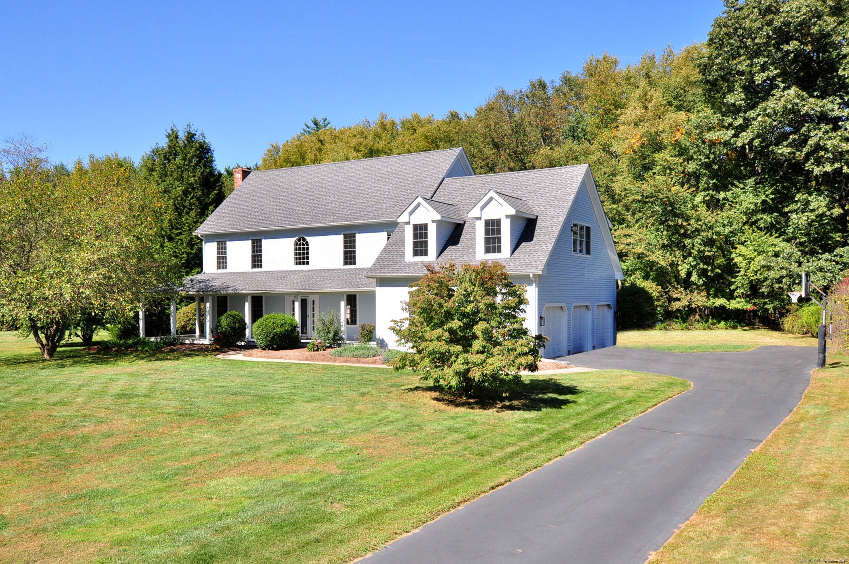 Step into this stunning West Granby retreat, tucked away on a peaceful cul de sac and backing to scenic open space.