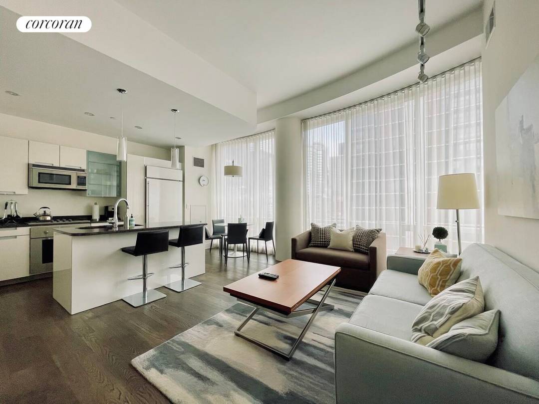 Experience unmatched luxury in this stunning and sun drenched high floor 2 bed 2 bath residence at 250 East 49th Street, known as The Alexander.